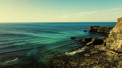 Seascape of the Atlantic Ocean bay with rocks above the water. Aerial view