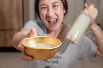 Asian women enjoying drinking makgeolli to celebrate. Makgeolli rice wine is a Korean fermented alcoholic beverage traditional drinks.