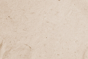 Cardboard, beige paper texture cardboard background close-up, inclusions of cellulose
