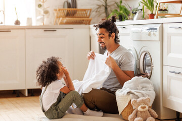 Dad and son playing with linen