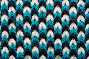 Blue, white and black pattern of synthetic knitted fabric texture