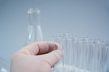 Close up view of transparent glass flask for biological research. Isolated on background. Laboratory tests and research. Chemistry science or medical biology experiment. Laboratory background