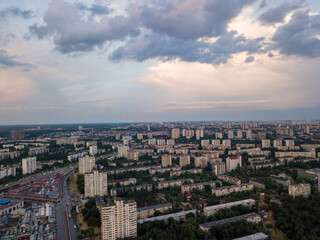 Sunset over Kiev. Rain clouds in the sky. Aerial drone view.