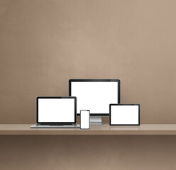 Computer, laptop, mobile phone and digital tablet pc. brown shelf background