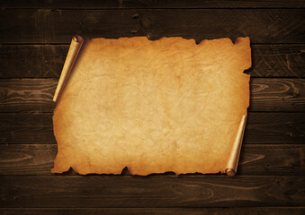 Old mediaeval paper sheet. Horizontal parchment scroll on a wood board