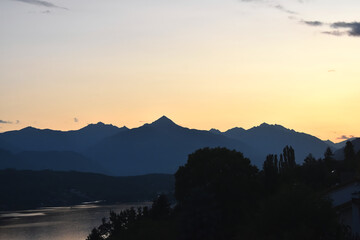 Scenic silhouette of mountains at Millstätter See in Austria in the dawn.