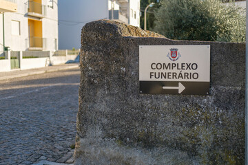 Sign pointing right to Castelo Branco funeral complex in central Portugal