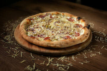 delicious italian pizza served on wooden table