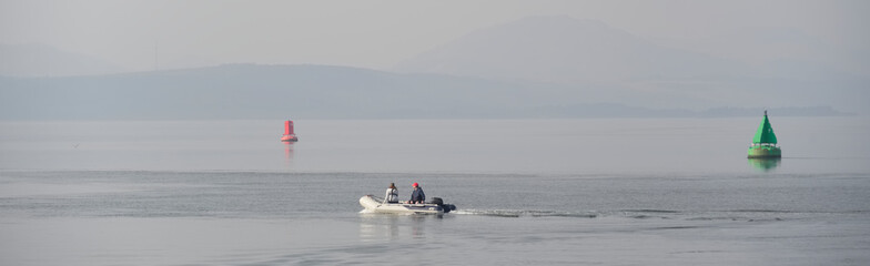 Fototapeta na wymiar Inflatable dingy boat out on sea adventure