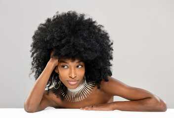 Beautiful young Black woman modelling a modern silver choker