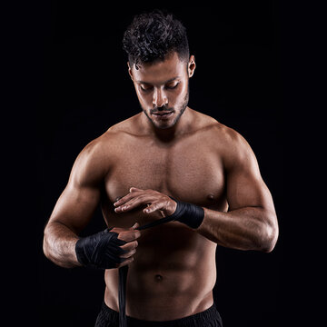 Proper preparation prevents poor performance. Studio shot of a young boxer isolated on black.