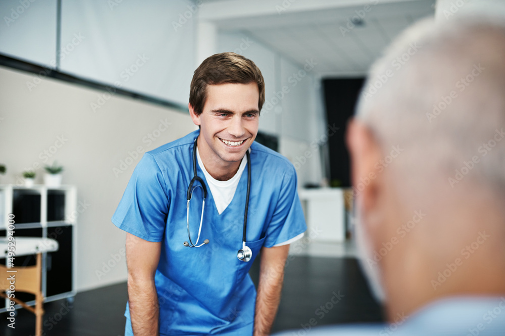 Sticker He serves with genuine compassion. Shot of a male nurse caring for a senior patient.