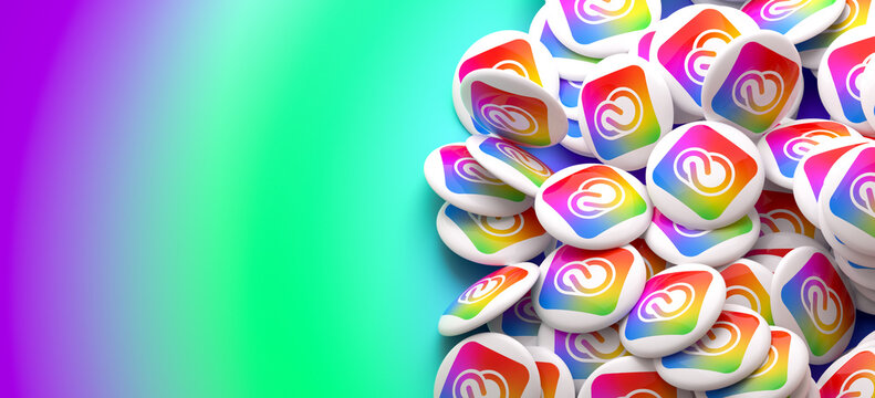 Logos of the Adobe Creative Cloud on a heap. Copy space. Web banner format.