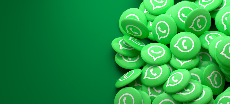 Logos of the WhatsApp on a heap. Copy space. Web banner format.