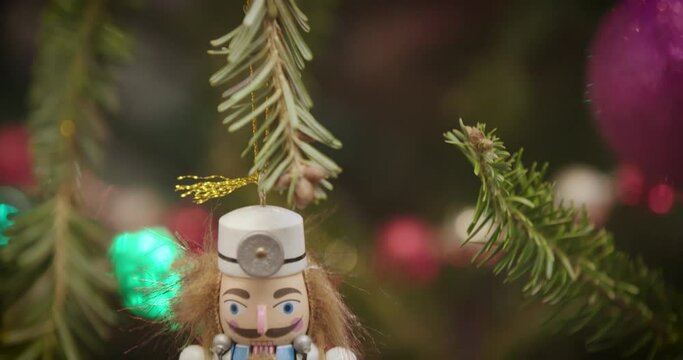 Christmas holiday tree ornaments medical doctor nutcracker close up face tilt down