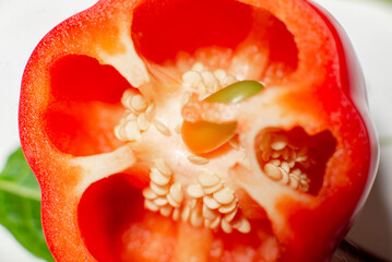 Red sweet pepper super macro. View inside. Bell pepper seeds close-up.