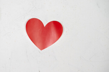 red paper heart isolated on white background.
