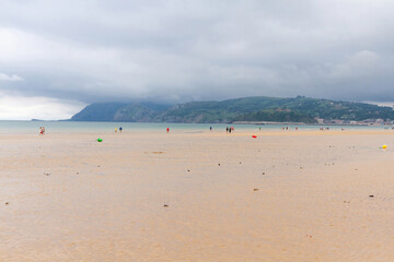 Fototapeta na wymiar Laredo beach with people in summer. Cantabria, Spain