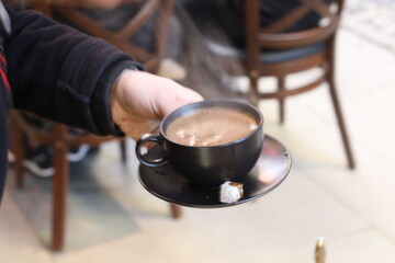 Turkish coffee cooked in hot sand in copper coffee pots prepared for tourists in Taksim, the most touristic district of Istanbul.