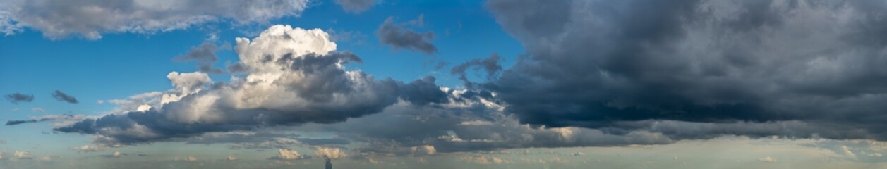 Naklejka na ściany i meble Fantastic soft thunderclouds, sky panorama