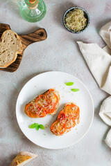 Ready to eat bread sandwich with sun dried tomatoes and clover and alfalfa sprouts on a plate on the table. Diet organic food. Top and vertical view