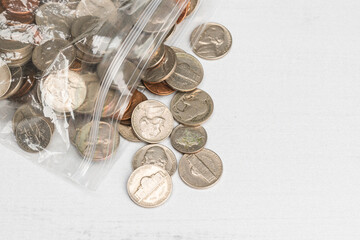 Assorted USA Coins Pouring our of a Plastic Zip Lock Bag