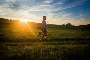 man running  at sunset healthy active lifestyle