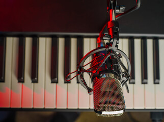 Close-up. Musical instrument - MIDI keyboard and microphone. Vocal, music, concert recording in a...
