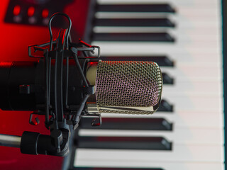 Close-up. Modern synthesizer, MIDI keyboard and microphone. Modern technologies, electronic...
