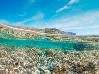 Split underwater view of La Speranza beach blue sea