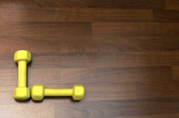 Yellow Dumbbell angle, fitness and healthy lifestyle, copy space