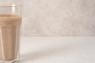 Delicious homemade cocoa drink with milk and cocoa powder. Copy space.