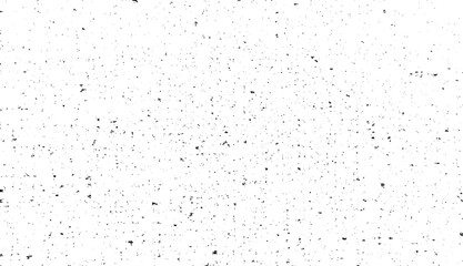 Small uneven spots and particles of debris. Abstract vector texture. Distressed uneven background. Grunge texture overlay with fine grains isolated on white background. Vector illustration. EPS10.