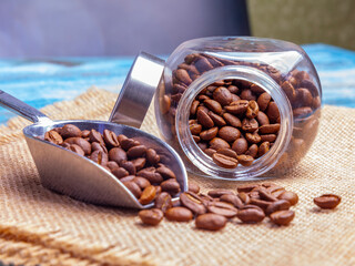 Seeds of coffee are scattered on a table
