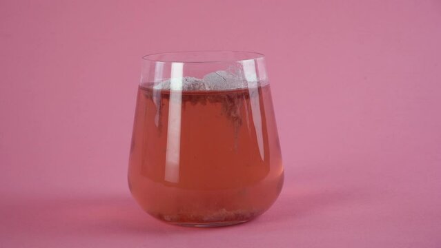 Collagen dissolves in a glass of water. Superfood additives. Close-up.