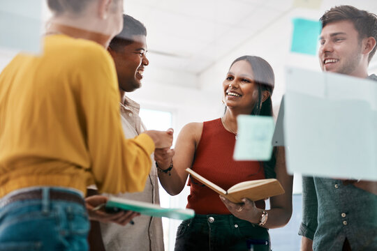 Our collaboration works because our skills complement each other. Shot of businesspeople shaking hands during a meeting in an office.