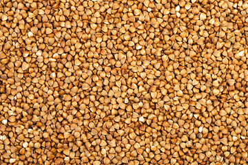 Buckwheat grains evenly spaced on the surface for background