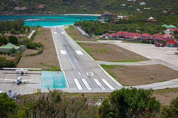 Photo of the runway of the airport at St Bart's in the Caribbean - obrazy, fototapety, plakaty