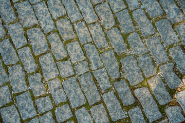 Old stone floor background. Macro shot of the street bricks. Background texture with old dirty and vintage style pattern