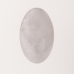Lovely Easter minimal concept. Optimistic flat lay arrangements made of gray fluffy texture  egg shaped with ow white background.