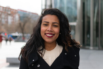 Portrait of smiling young woman outdoors

