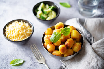 Fried potato gnocchi with cheese filling