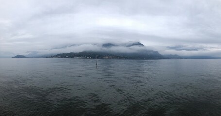 foggy mountains and water