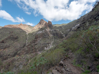 Fototapeta na wymiar Barranco Seco gorge landscape with steep green slopes, Tenerife, Canary islands, Spain