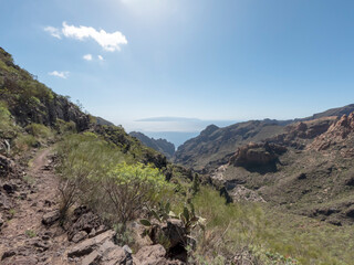 Fototapeta na wymiar View on the Atlantic ocean and La Palma island from the Barranco Seco gorge, Tenerife, Canary islands, Spain