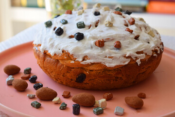 A bouquet of daisies, homemade cakes for Easter on the table