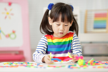 young girl playing creative blocks for homeschooling