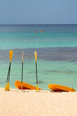  Orange boats with oars on the sandy shore. Beautiful seascape on the Caribbean Sea in the...