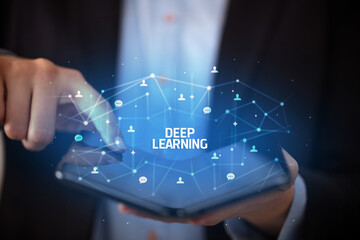 Businessman holding a foldable smartphone, new technology concept