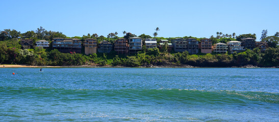 Houses built on a cliff above Kalapaki Beach on the South Shore of Kauai island in Lihue, Hawaii,...